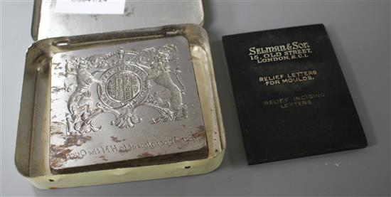 A cut steel seal matrix with the Royal Coat of Arms and engraved by appointment to HM The Queen, 6.5 x 7cm, with makers plaque of Sel